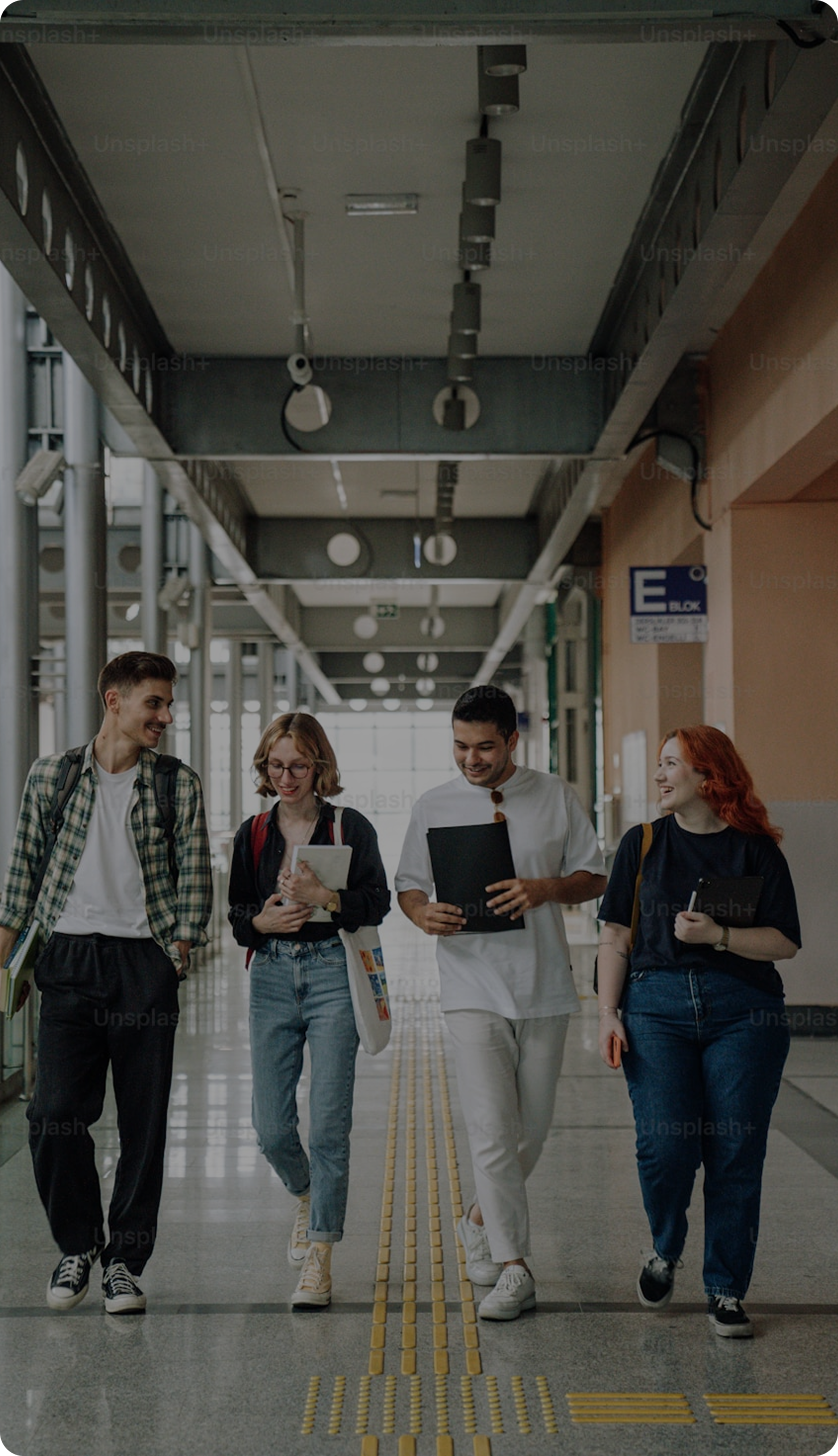Students walking together through a campus corridor