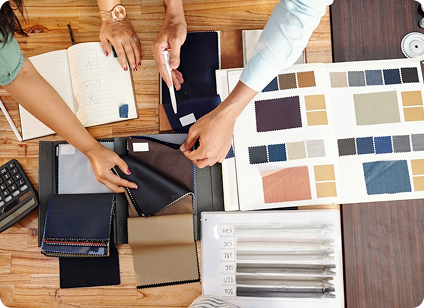 A team collaborating over brand materials and color swatches